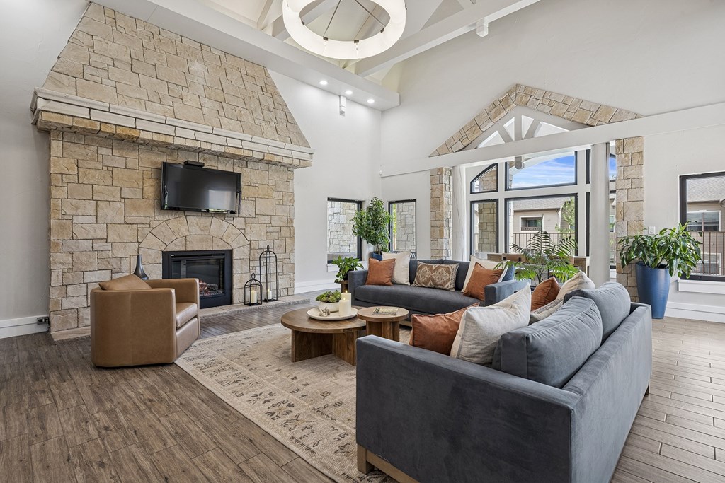 Resident clubhouse lounge with fireplace - Grand Centennial Apartments