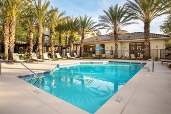 Hills of Valencia Apartments swimming pool with surrounding sundeck - Photo Gallery 3