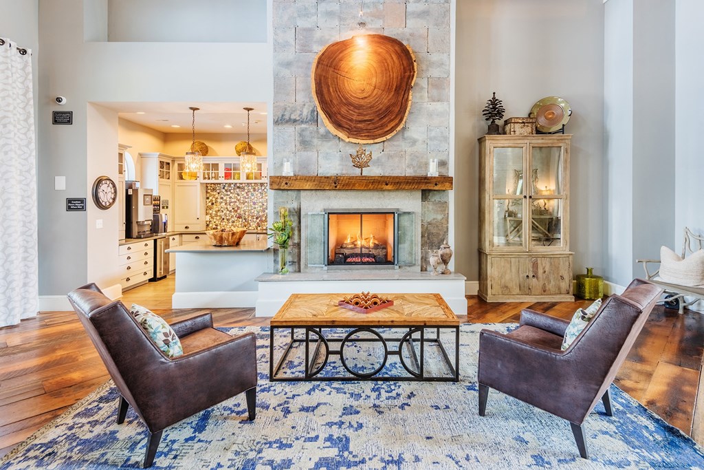 Windward Long Point Apartments - Clubhouse interior with fireplace and coffee bar