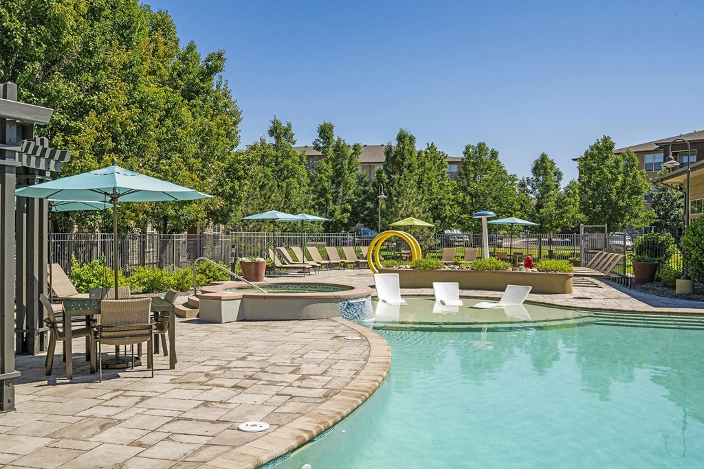 Ample seating with umbrellas - Acadia at Cornerstar Apartments