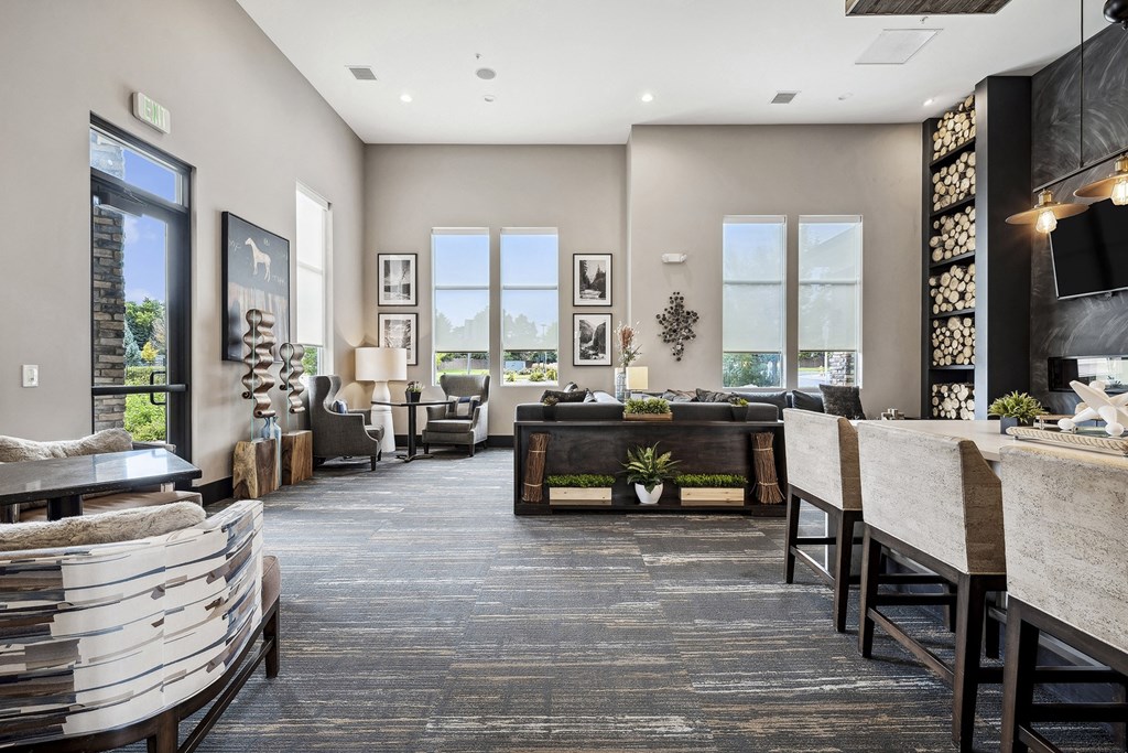 a large living room with a couch and a table