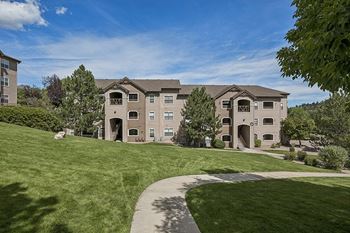 Beautifully landscaped grounds in a private setting - Grand Centennial Apartments