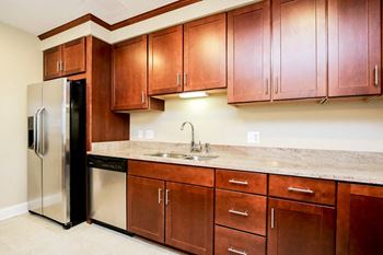 Harbor Hill Apartments kitchen with cherry cabinets
