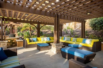 Hills of Valencia Apartments outdoor lounge area with ample seating - Photo Gallery 5