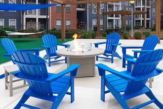 Island Park and Harbor Town Square Apartments - Fire pit with seating Island Park and Harbor Town Square Apartments - Fire pit with seating