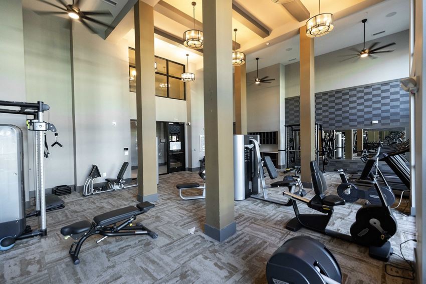 The Juncture Apartments fitness center with cardio equipment - Photo Gallery