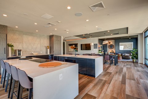 a large kitchen and dining area with a table and chairs