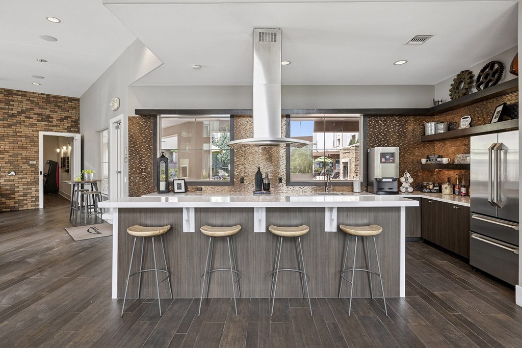 Coffee bar with bar stool seating - First and Main Apartments