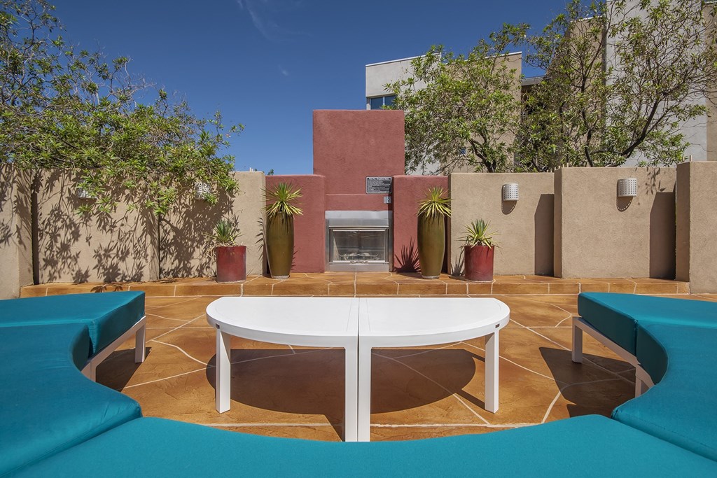 Poolside fireplace lounge - ABQ Uptown Apartments