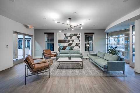 a living room with couches and chairs and a coffee table