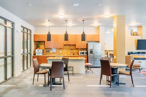 a large kitchen and dining room with a table and chairs