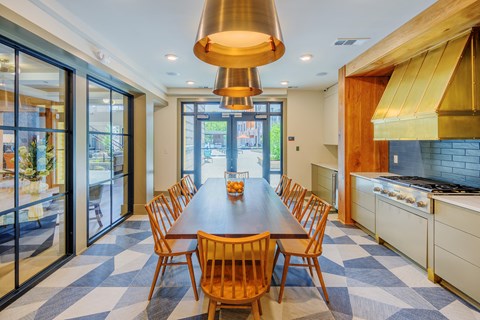 the dining room is open to the kitchen and has a large table and chairs