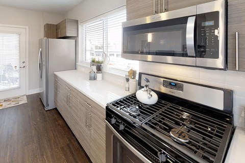 a kitchen with a stove and a microwave