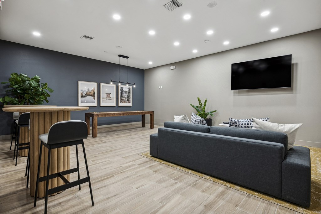 Resident lounge with multiple flat-screen TVs - Acadia at Cornerstar Apartments