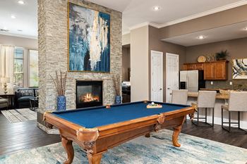 Cordillera Ranch Apartments - Clubhouse with a demonstration kitchen, billiards room and fireside lounge