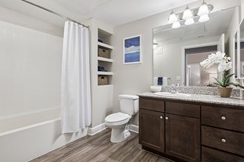 Wood-style flooring in bathrooms, kitchens and entryways - First and Main Apartments