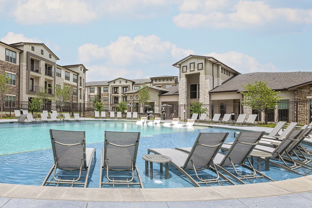 Sundeck surrounding resort-style pool - Debbie Lane Flats