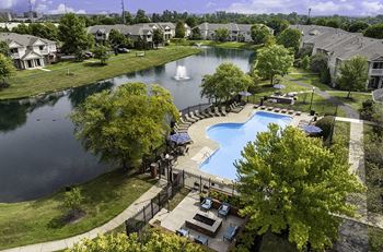 The Gardens at Polaris walking trail surrounding lake with fountains
