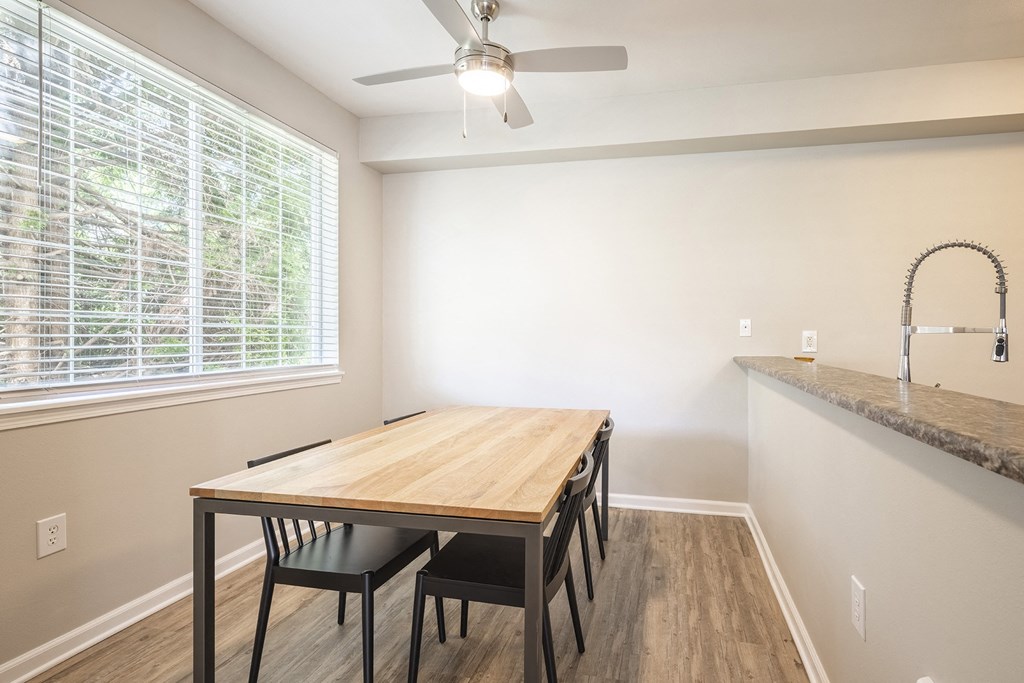Lighted ceiling fans over dining area - Springbrook Apartments