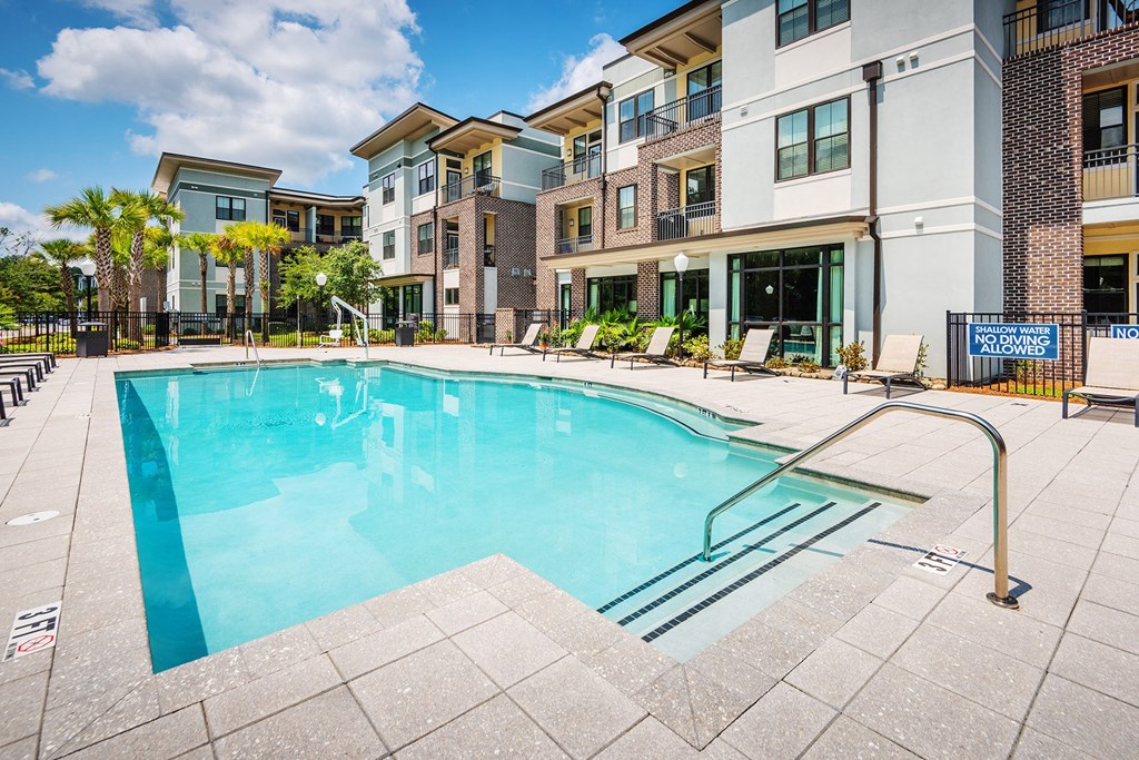 Centre Pointe Apartments resort-style pool area with surrounding sundeck