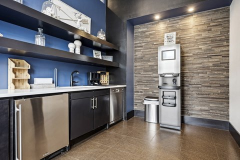 a kitchen with stainless steel appliances and a refrigerator