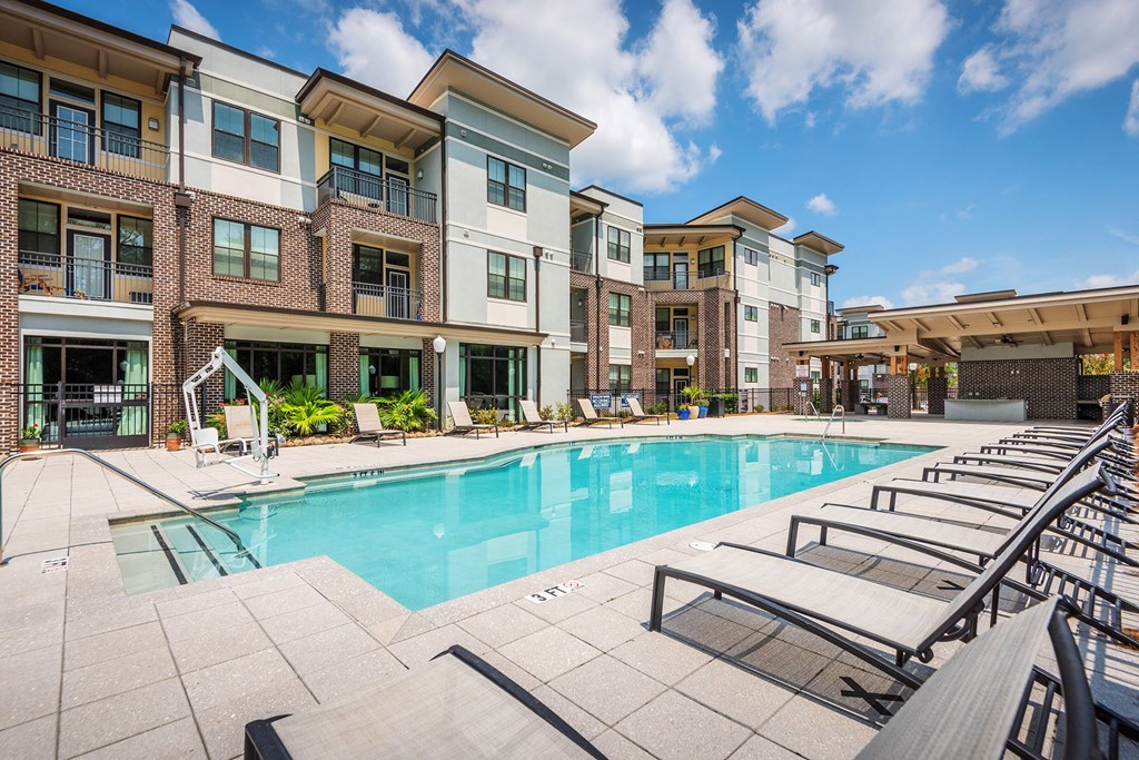 Centre Pointe Apartments resort-style pool area with surrounding sundeck