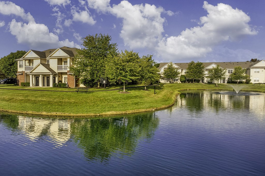 Pond with walk way for leisurely strolls - The Gardens at Polaris