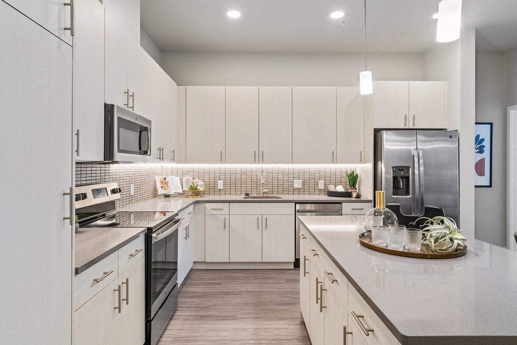 Arazo apartment kitchen with white cabinets