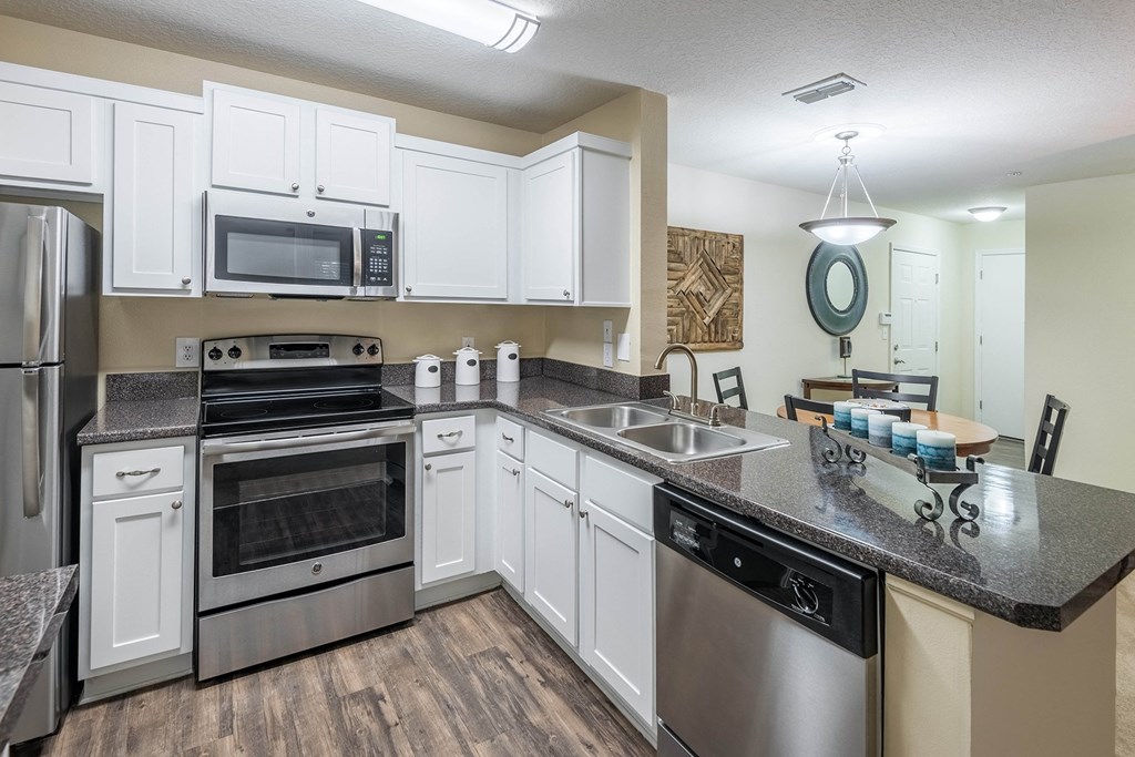 The Colony at Deerwood Apartments - Open kitchens with stainless steel appliances