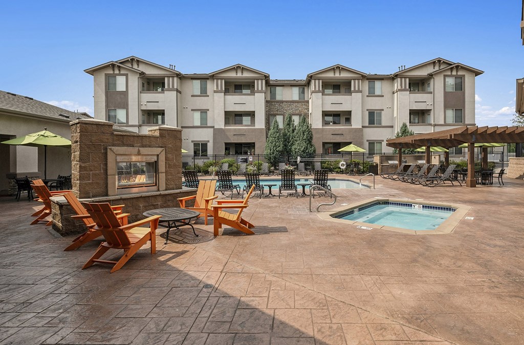 Poolside heated spa and fireplace lounge - First and Main Apartments