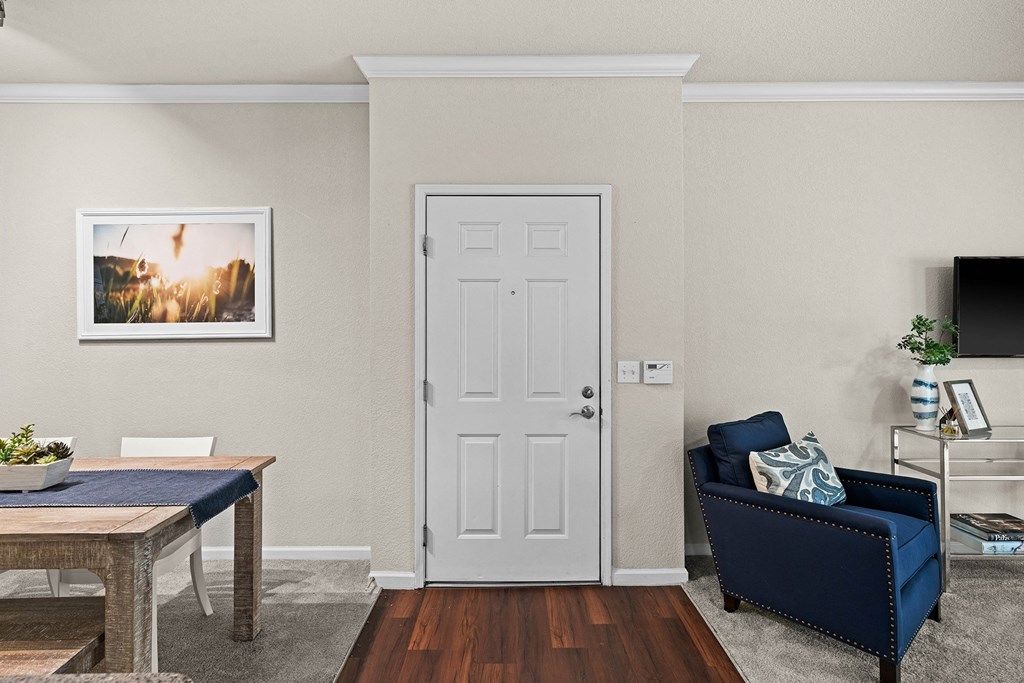 Wood-style flooring in entry foyers - Willow Spring Apartments