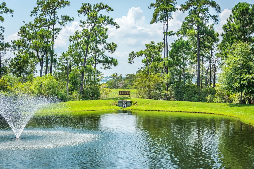 Windward Long Point Apartments - Walking path around water with benches
