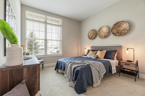 The Airdrie at Paoli Station carpeted bedroom with oversized windows