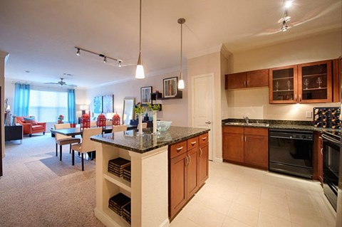 a kitchen and dining room with a table and chairs