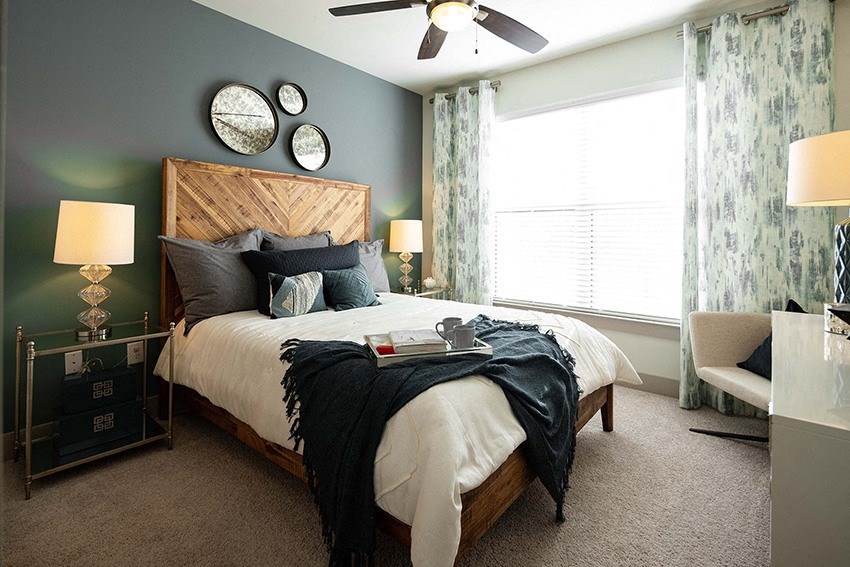 The Juncture Apartments bedroom with ceiling fans