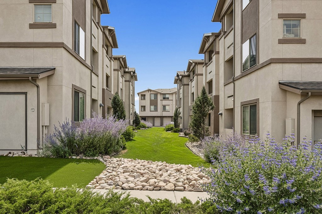 Well-manicured landscaping - First and Main Apartments