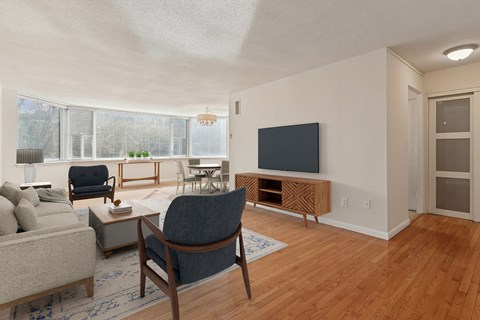 A living room with a grey chair and a grey sofa.
