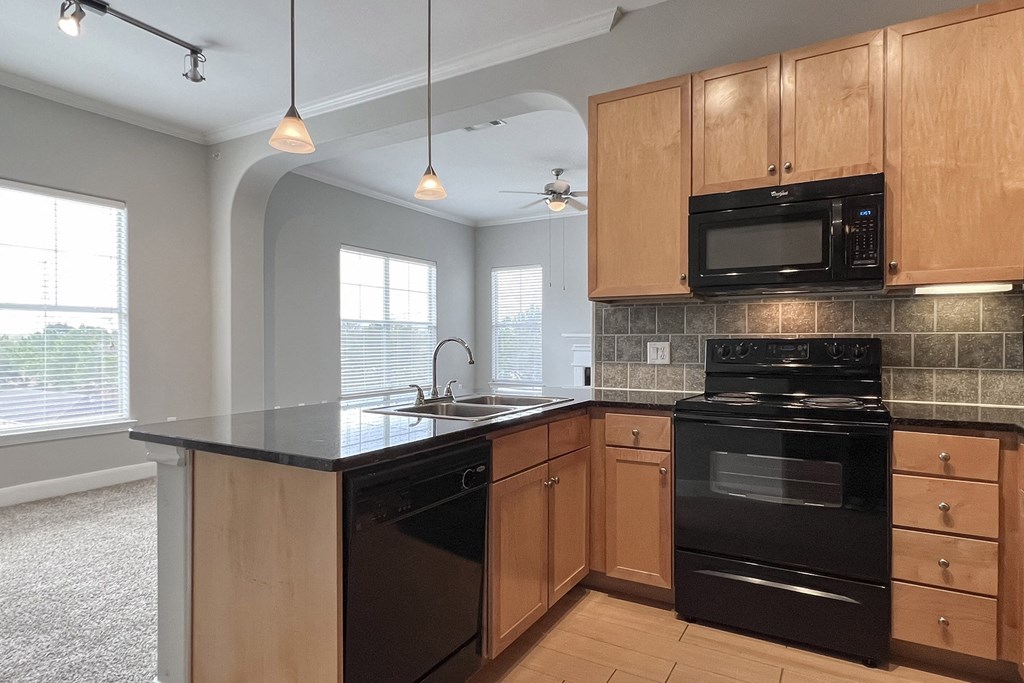 The Retreat at Cinco Ranch apartment kitchen with breakfast bar