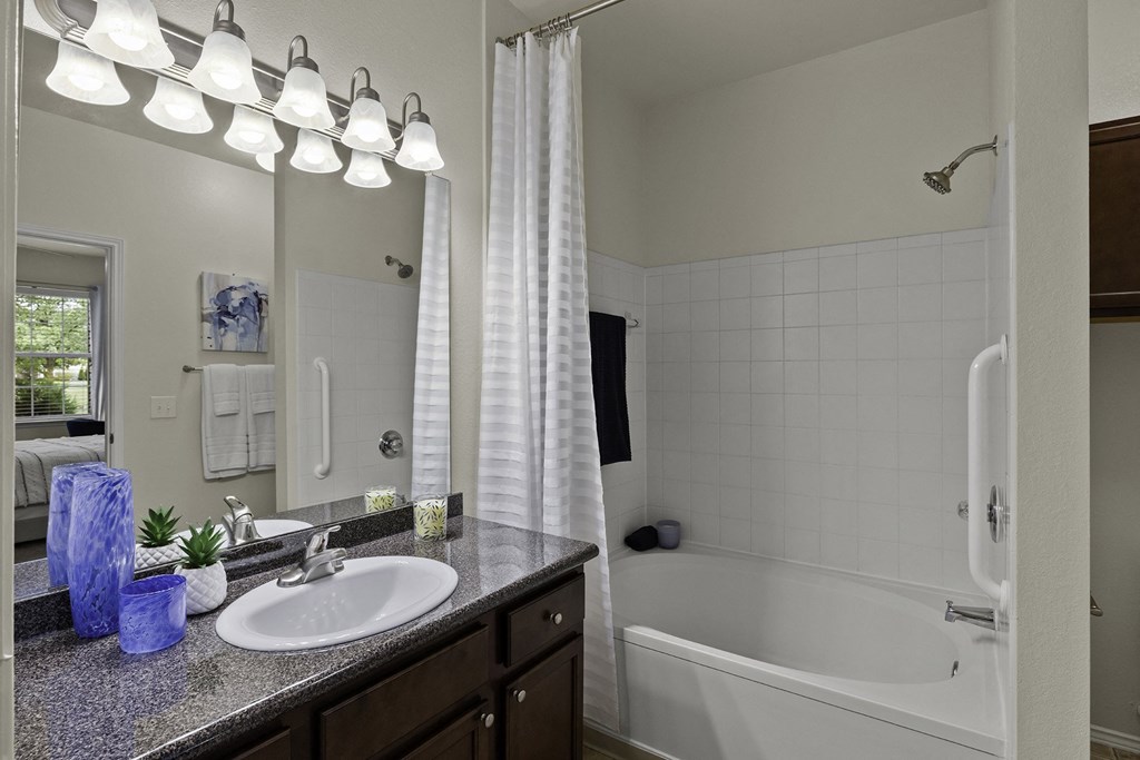 Well-lit vanity mirrors in bathrooms - The Gardens at Polaris