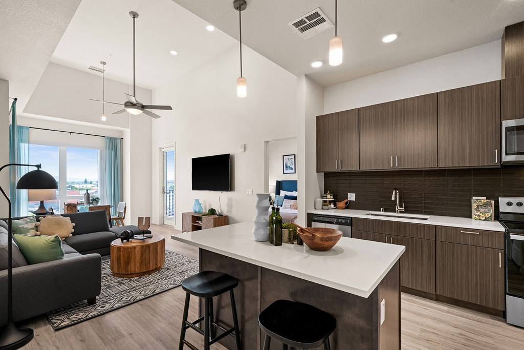 Wood-style flooring with carpeted bedrooms - La Via Apartments