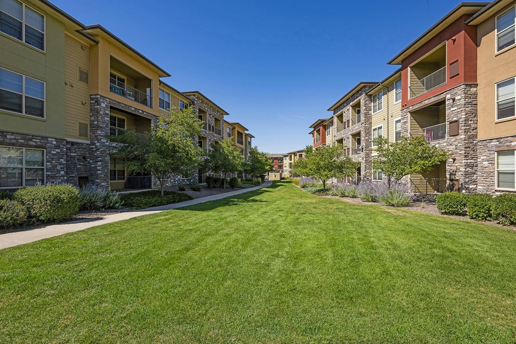 Well-manicured landscaping - Acadia at Cornerstar Apartments
