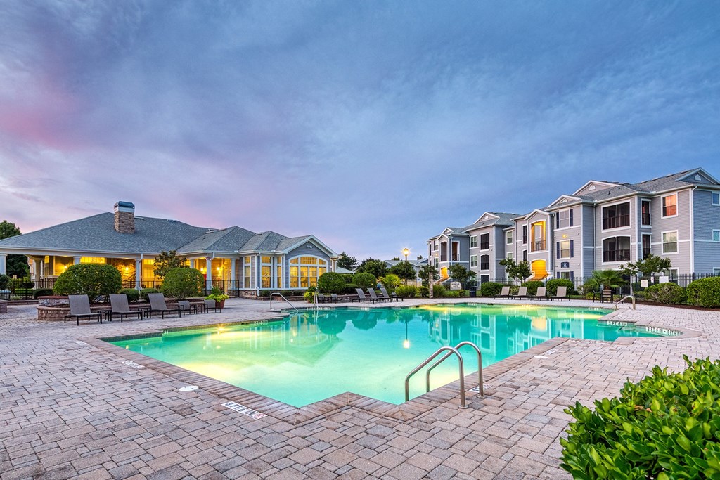Courtney Station Apartments - Resort-style pool at dusk