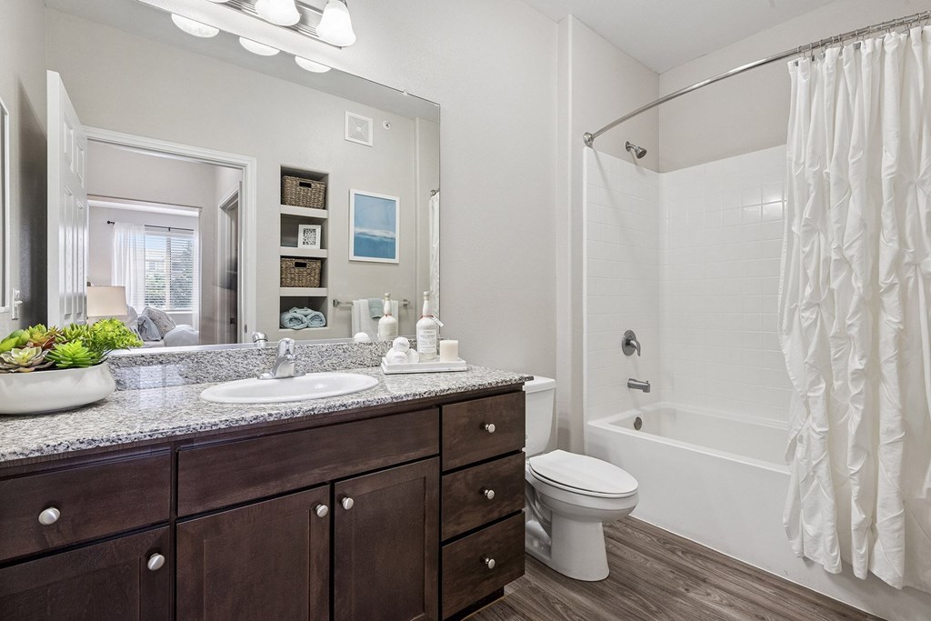 Wood-style flooring in bathrooms, kitchens and entryways - First and Main Apartments