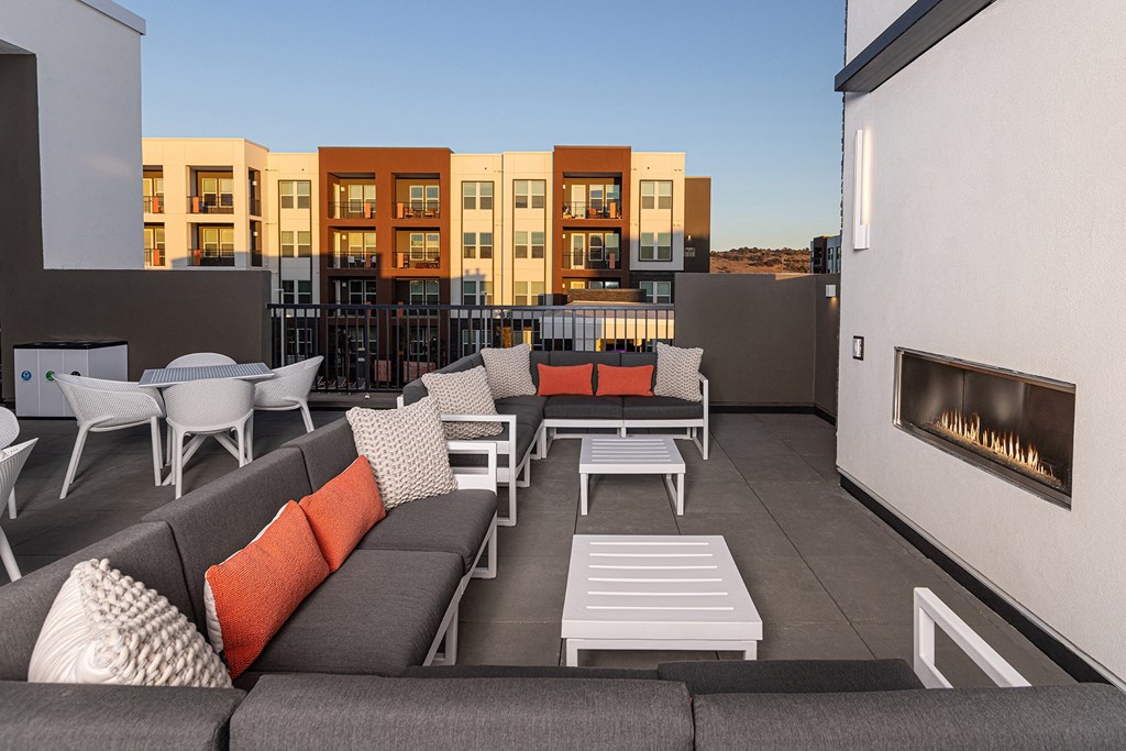 Rooftop deck with a fireplace and outdoor cooking station - NOVA at Green Valley