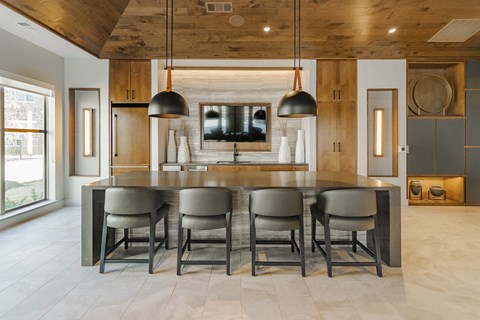 a large kitchen with a table and chairs