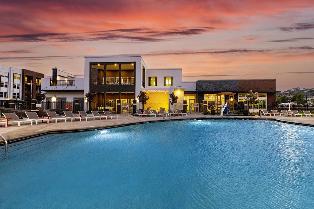Resort-style pool at dusk - NOVA at Green Valley