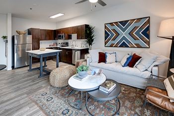 Stained concrete and wood-style flooring in select units - ABQ Uptown Apartments