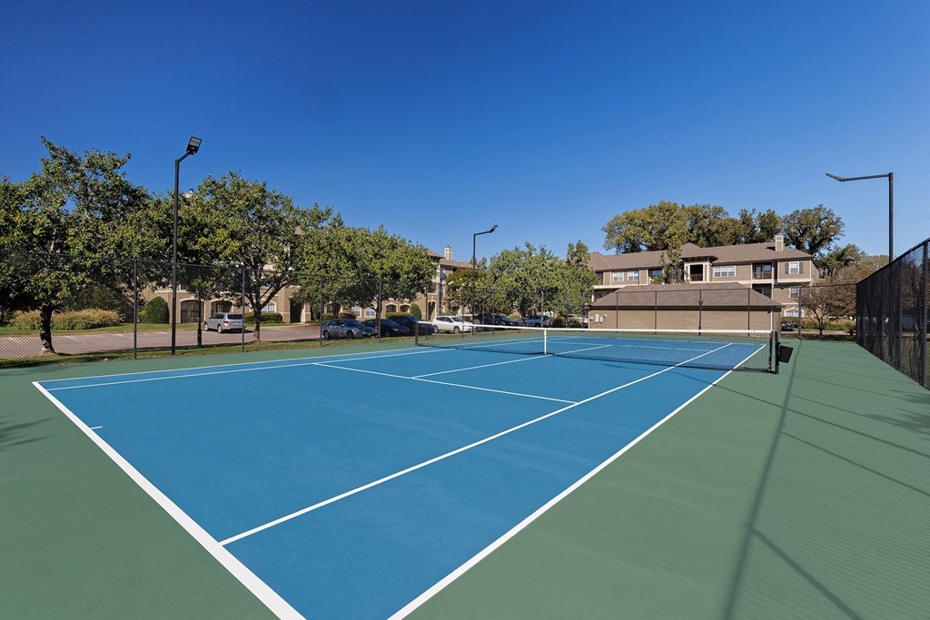 The Estates at River Pointe outdoor lighted tennis court