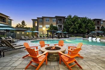 Fire pit with lounge seating - Acadia at Cornerstar Apartments