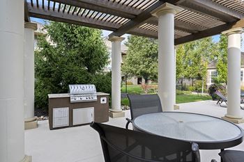 The Fairways at Corbin Park poolside cabana with BBQ grill and seating